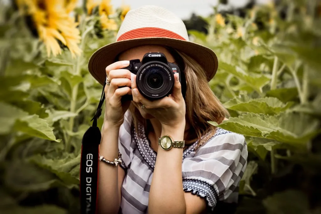imgi 2 canva selective focus photography of woman holding dslr camera MADGvxFl Ns